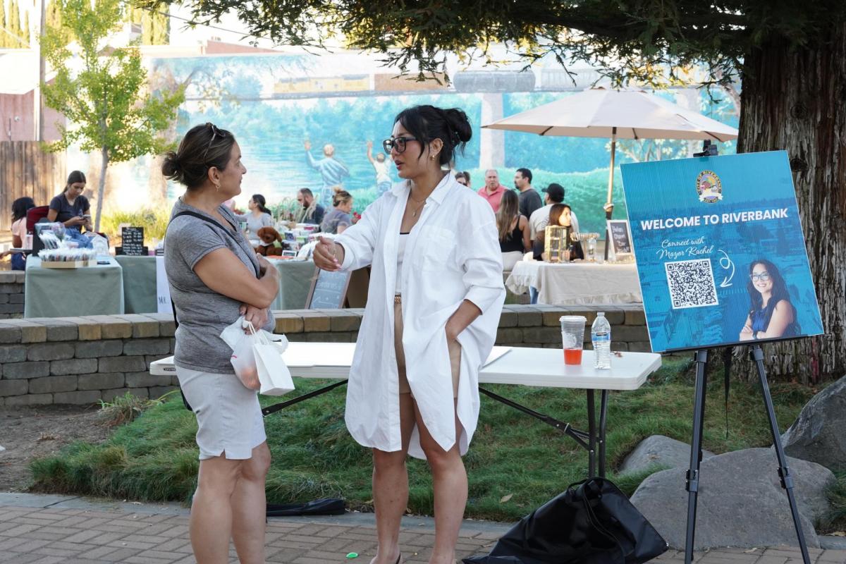 Riverbank Mayor Rachel Hernandez speaks with a resident during a community event. The city has worked to strengthen communication and build trust with residents.