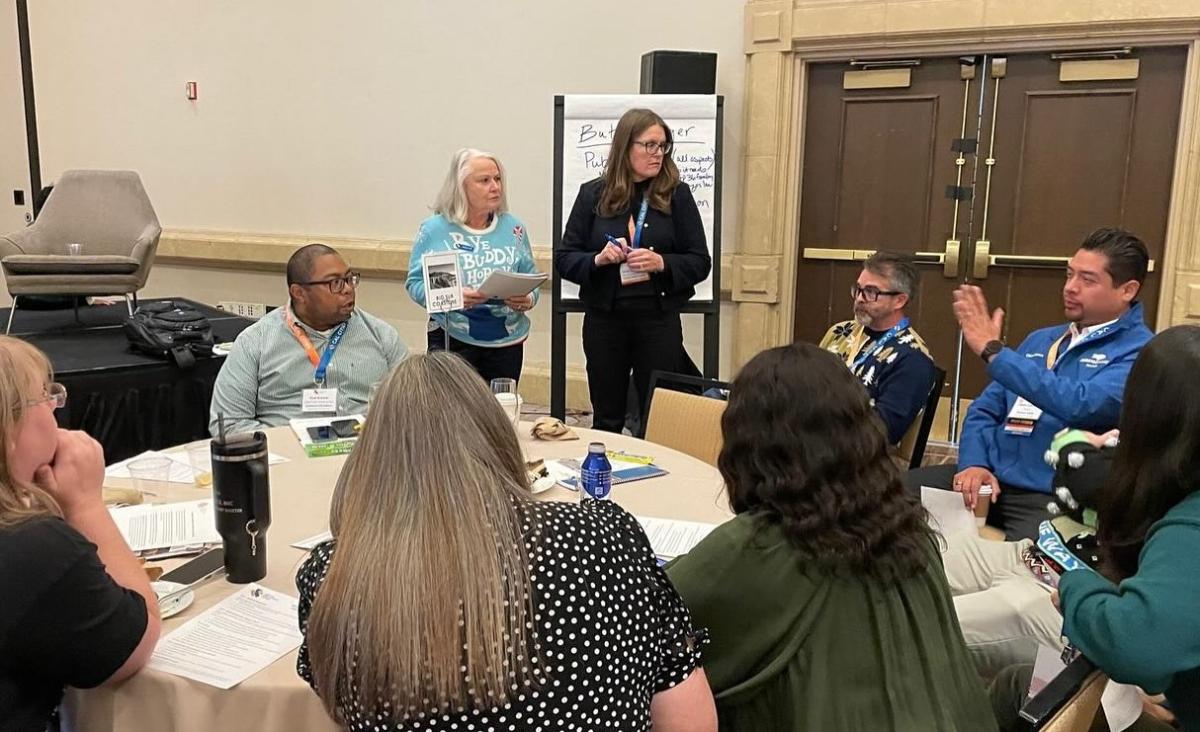 City leaders collaborating on Cal Cities’ advocacy priorities in December 2025. Members chose protecting and enhancing local revenues to support essential services as a top priority. City leaders collaborating around a table