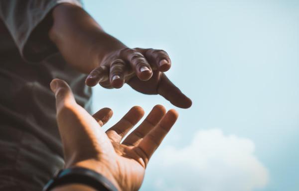 Hand reaching for support