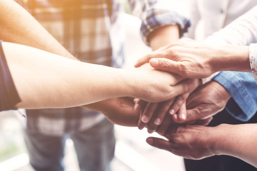 Diverse hands joined together