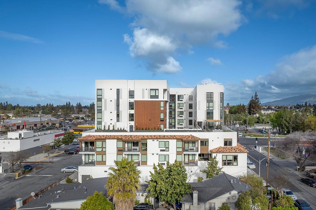 Wide exterior shot of affordable housing project, The Vela.