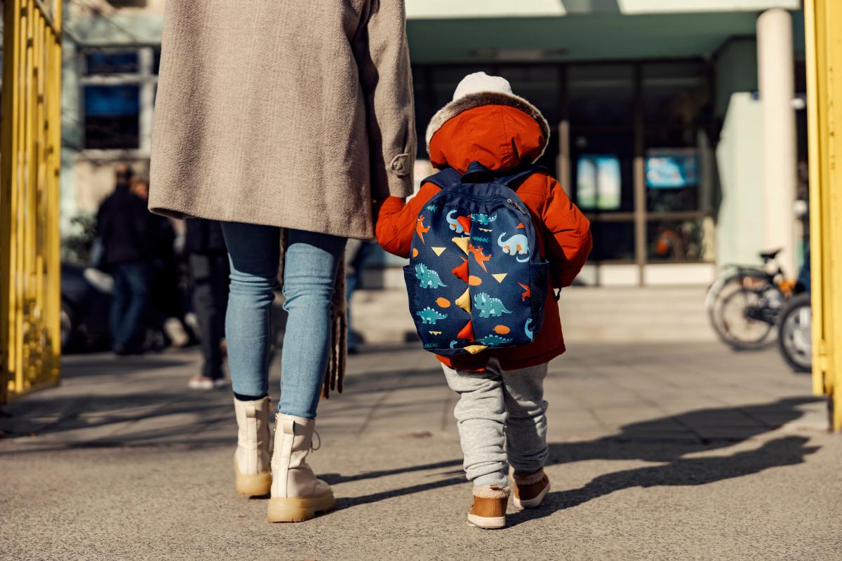 Parent walking child to school