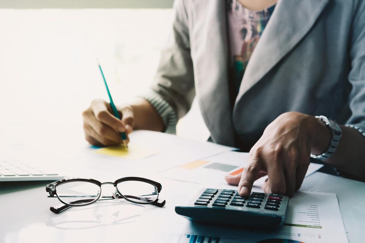 Woman calculating funds