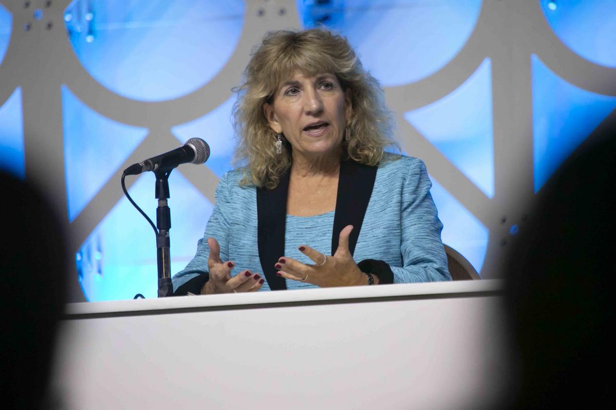 Woman speaking at podium