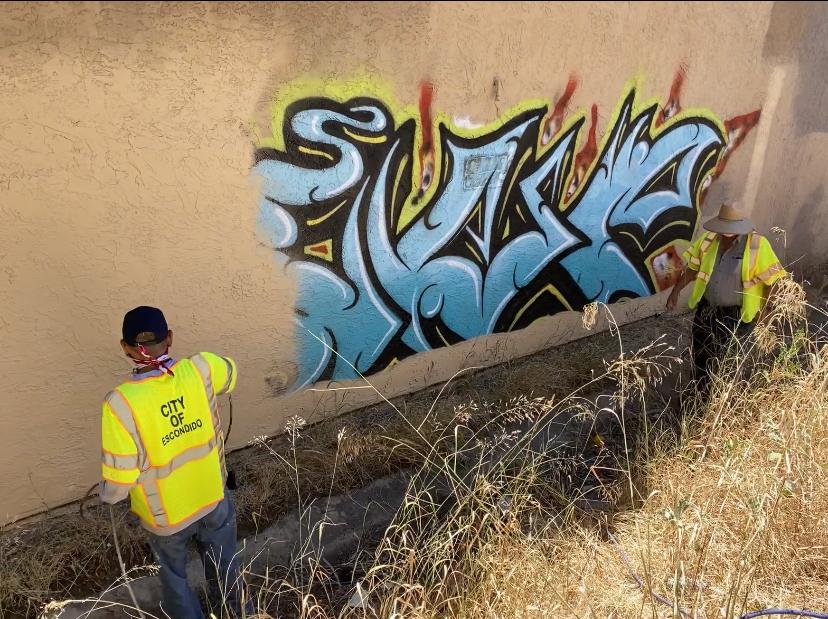 City of Escondido public works employees remove graffiti. 