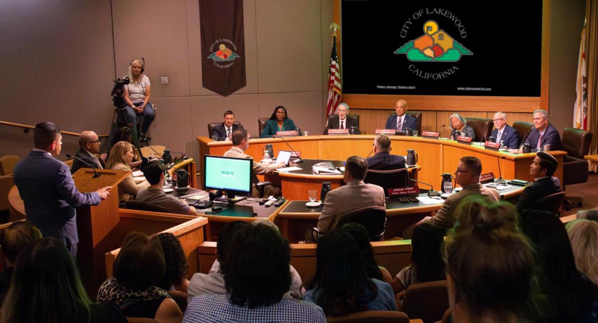 A group of residents watching a Lakewood city council meeting in person..