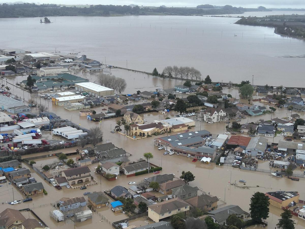 An aerial view of a flooded town.