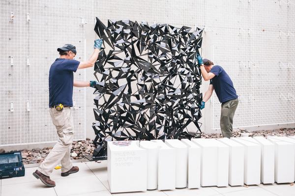 Art preparators installing "Bishop". © Christopher Puzio, photo credit: Stacy Keck