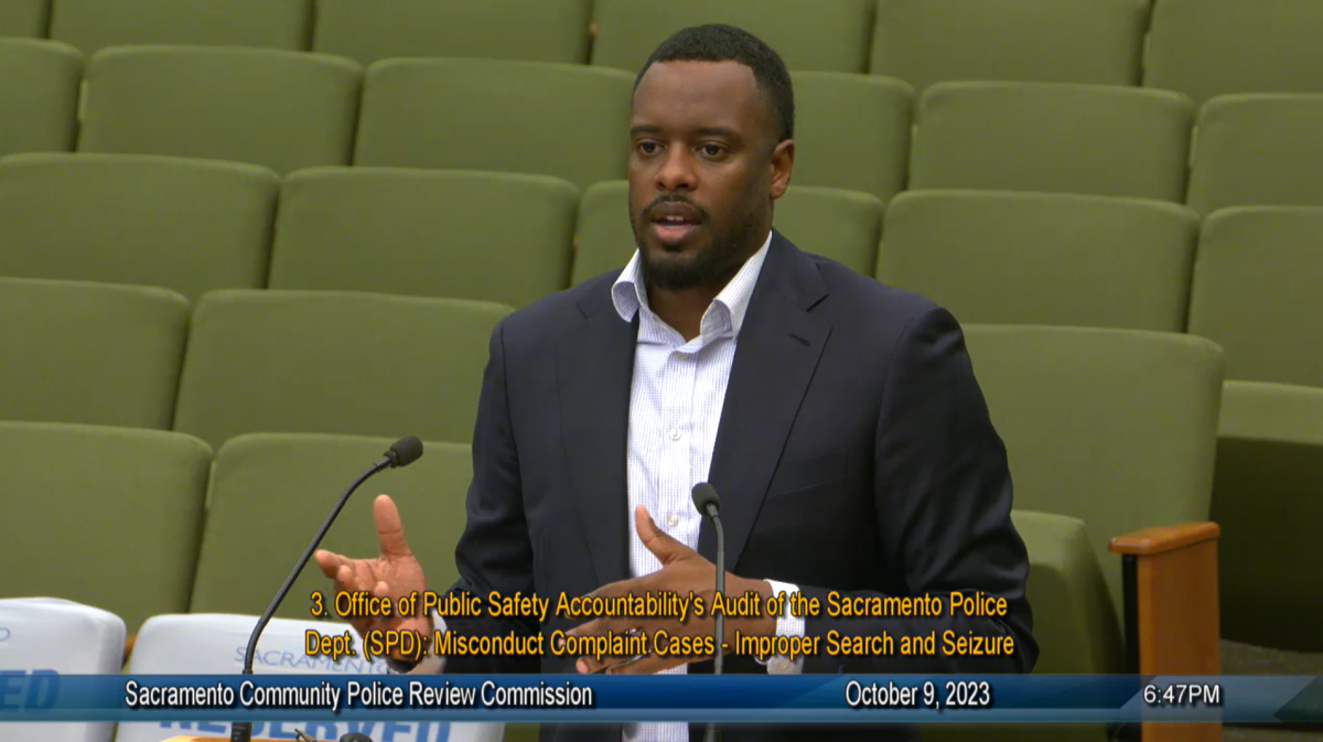 Man speaking at podium.