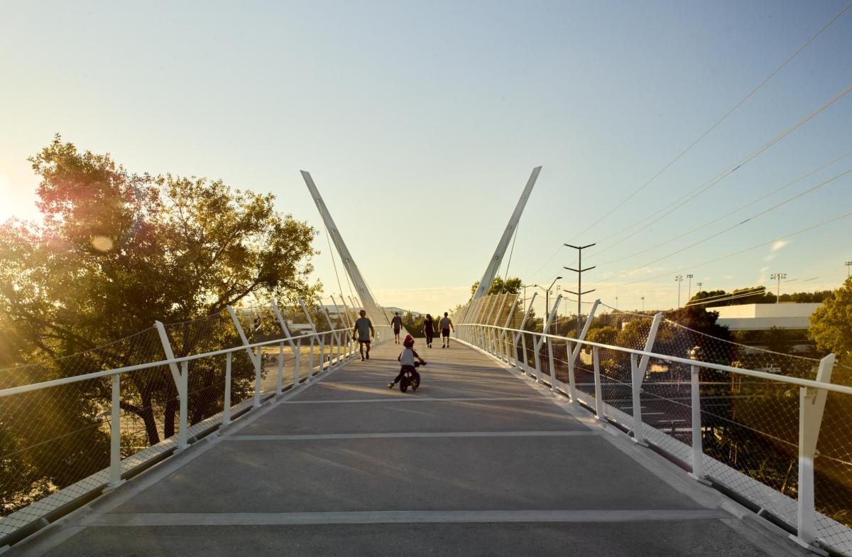Cyclist riding down San Ramon's new overpass