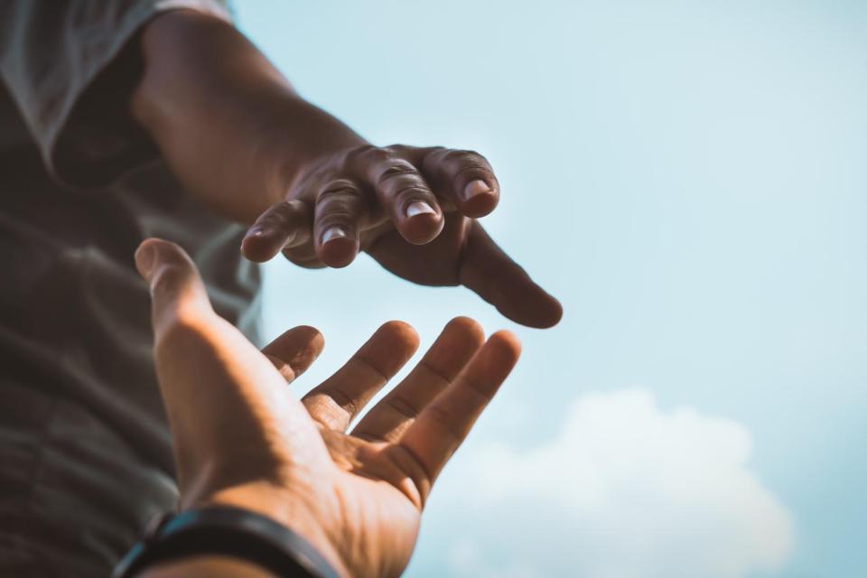 Hand reaching for support