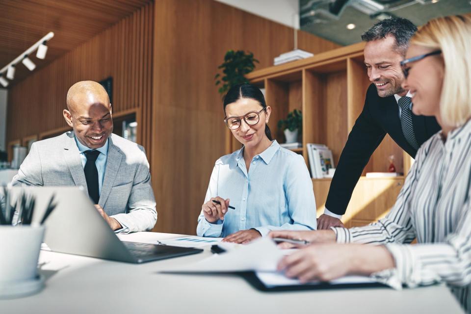 Group of professionals reviewing data