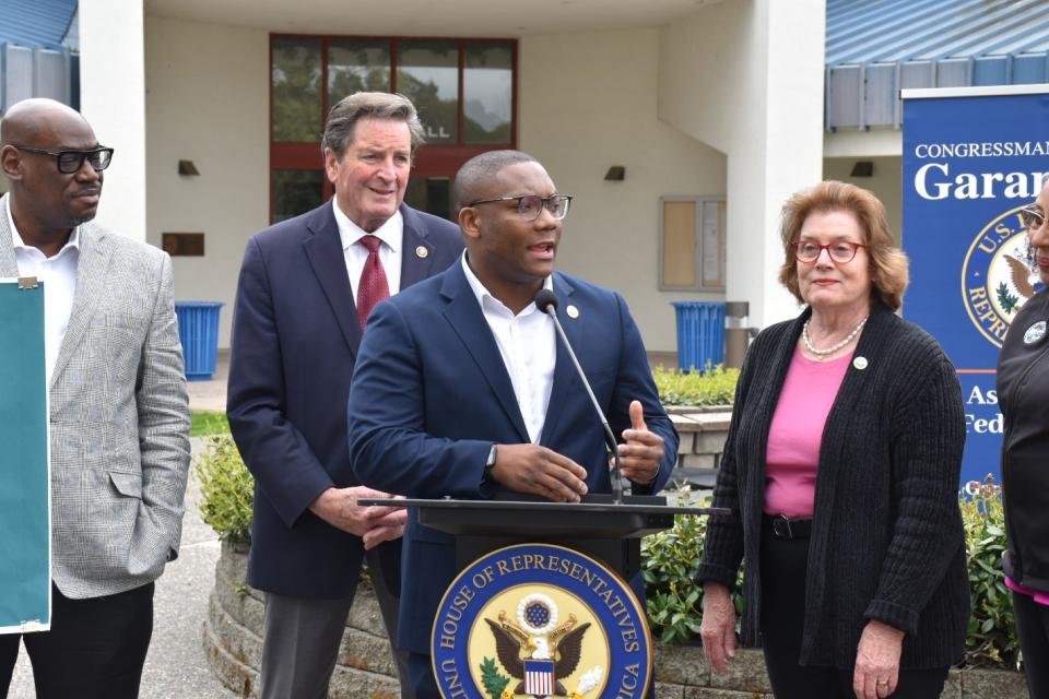 Alex Walker-Griffin speaking with leaders behind him