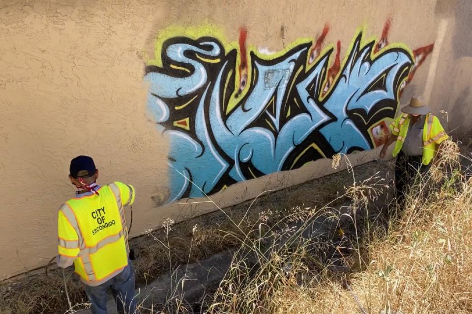 City of Escondido public works employees remove graffiti. 