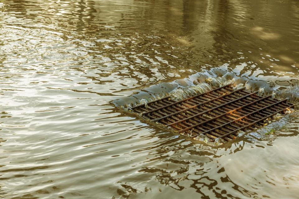 Storm water flows through drain.