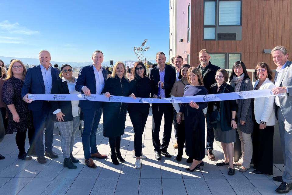 Community leaders gather for ribbon cutting