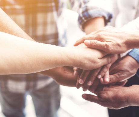 Diverse hands joined together
