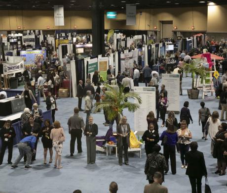 Attendees visit the expo hall.