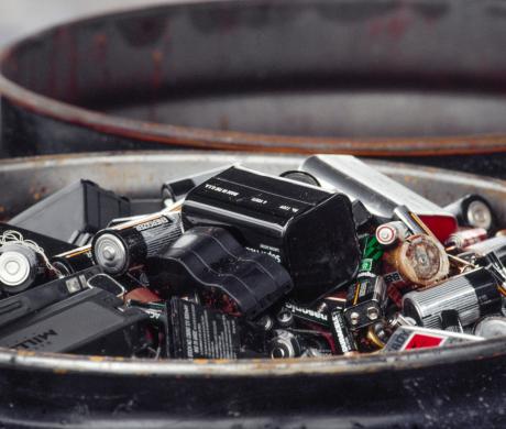 Household batteries in a trash bin