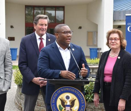 Alex Walker-Griffin speaking with leaders behind him