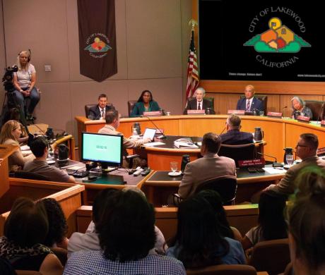 A group of residents watching a Lakewood city council meeting in person..