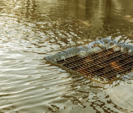 Storm water flows through drain.